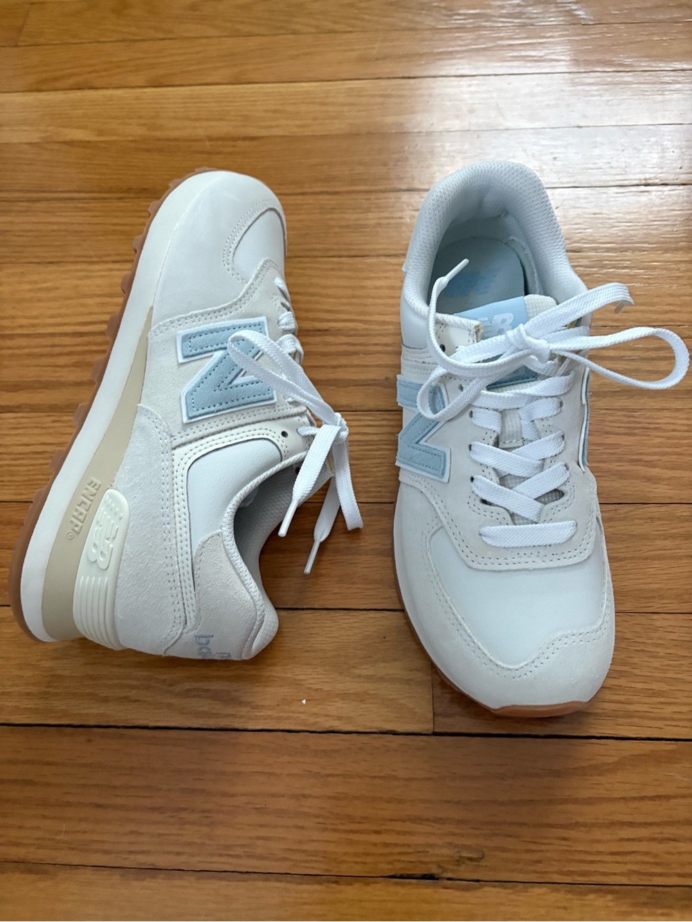 New Balance Women's Sneakers in White with Light Blue Accents